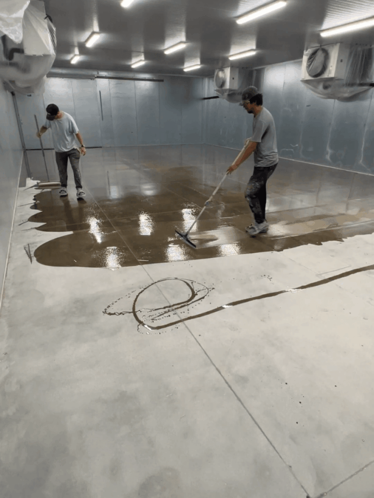 Installing moisture vapor barrier primer on commercial concrete floor