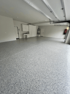 Professional polyaspartic garage floor coating with glossy finish in Bakersfield home