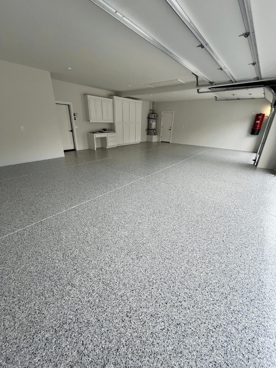 Professional polyaspartic garage floor coating with glossy finish in Bakersfield home