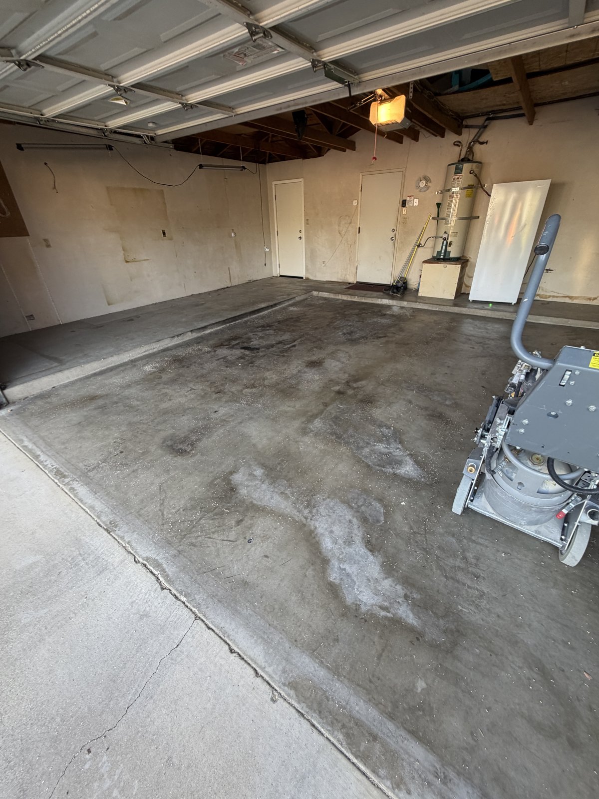 stained garage floor before coating Bakersfield CA — before