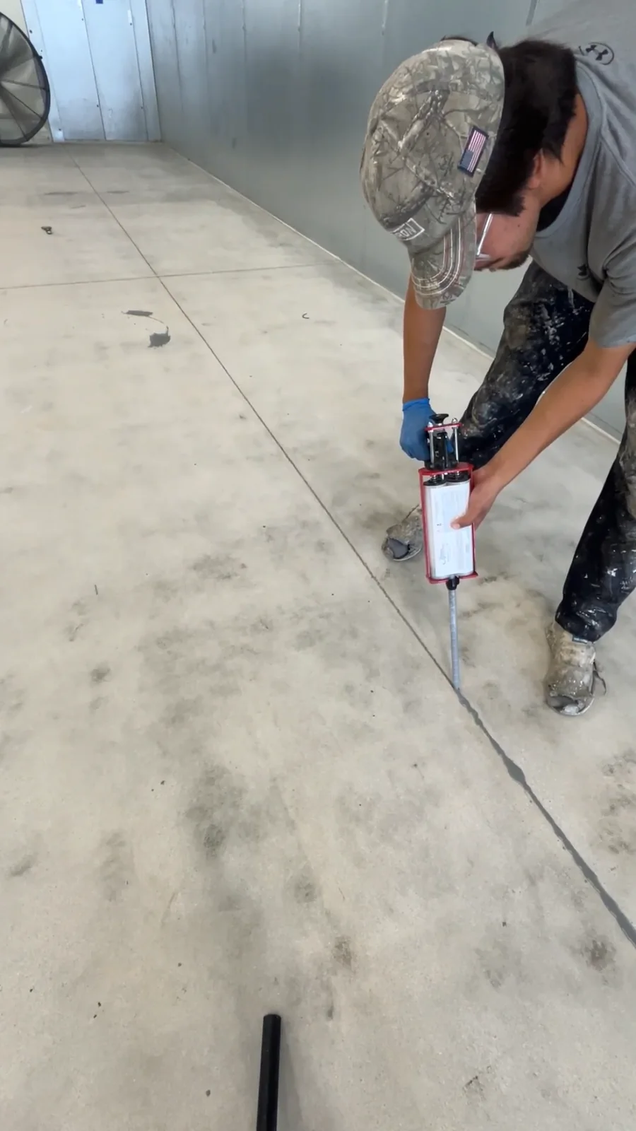 Husky Coatings crew applying polyurea joint filler in a commercial freezer room in Bakersfield, CA
